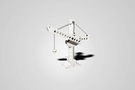 Stilllifefotografie eines Legokrans der ein Zahnimplantat in die Luft hebt auf neutralemn Hintergrund.